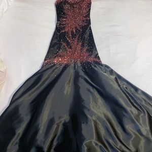 Black prom/pageant dress with red and silver bedding and sequin.